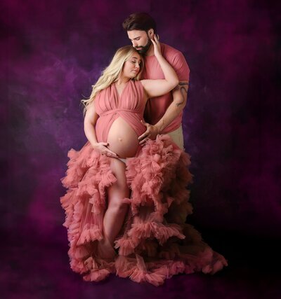 Gorgeous couple posing at their Denver maternity photography session.