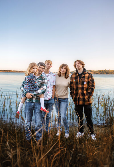 Family standing near Suffolk Riverfront at Sleepy Hole Park for Family Photo Session and Senior Photos at Sunrise in Fall - Rebekah Heffington Photography