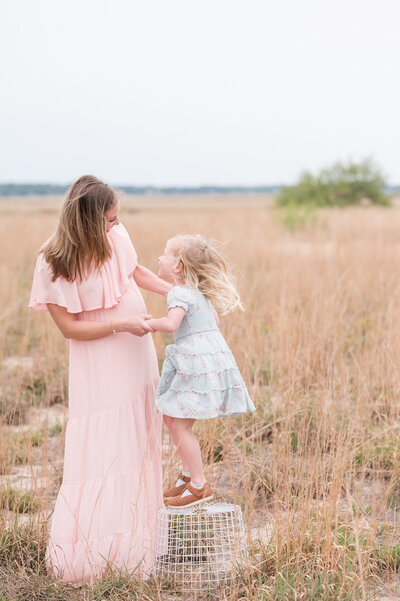 Mother and daughter in a field