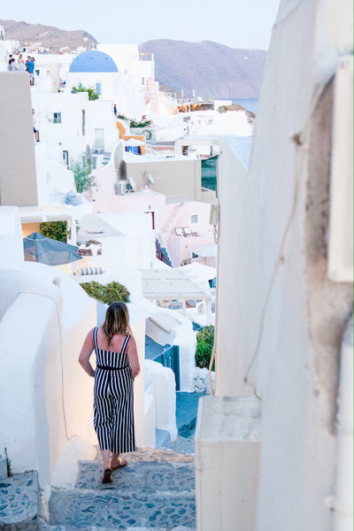 Woman on steps in Santorini Greece