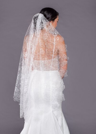 Link to more details and photos of the Lilies fingertip veil. It's an all-over floral and sequin embroidered veil.
