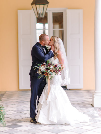 Winter Bride and Groom Kiss at William Aiken House Wedding