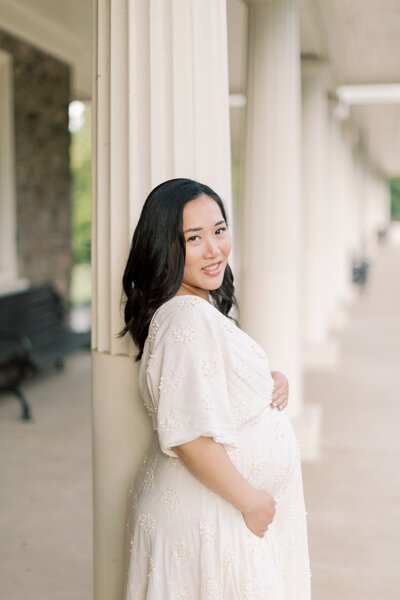 Stunning woman poses for portrait during maternity portrait session