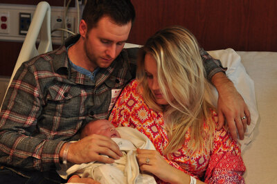 parents holding newborn in minneapolis hospital