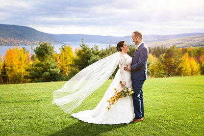 Couple lakeside at upstate  New York Bristol Harbour wedding in wine country