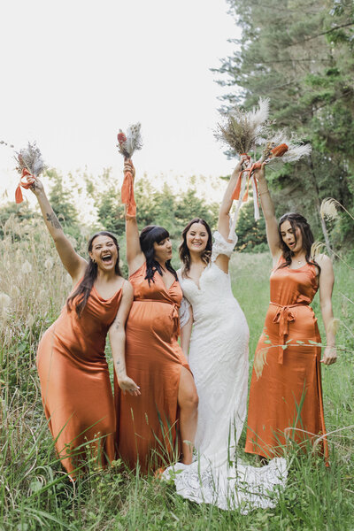 Bridal Party happy with hands in the air in Old Forest School venue