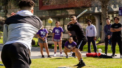 Students playing softball Whittier College