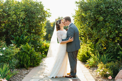 Bride and Groom kissing on a pathway at Gerry Ranch in California