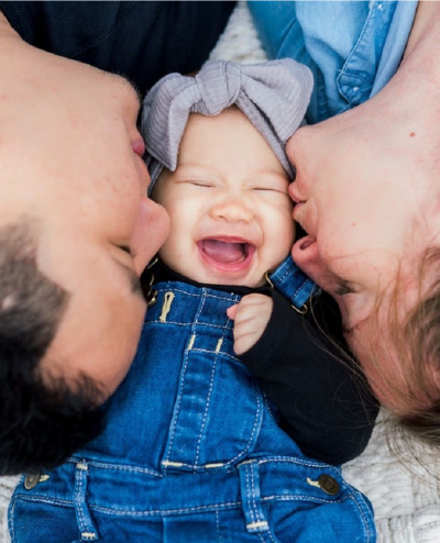 Family in Chicago kissing their Baby during a family photography session