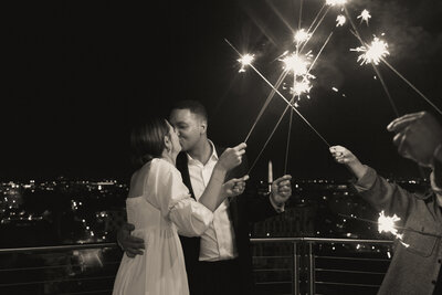 bride and groom with sparklers at wedding reception