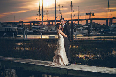 bride and groom on docks at the rice mill