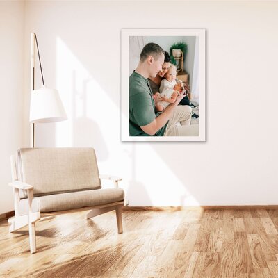 framed photo of family holding newborn during Springfield MO newborn photography session