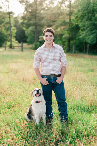 Boy Senior and his dog in a field