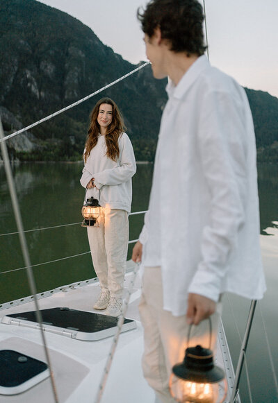 Squamish photographer captures couple on a sailboat with lanterns