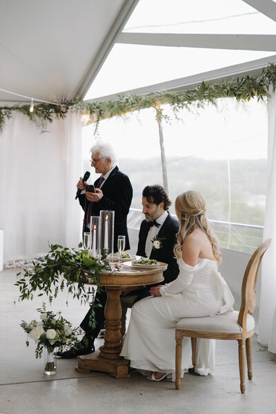 Father of the bride gives a speech at this outdoor Finger Lakes wedding