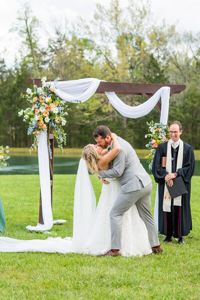 bride and groom about to kiss