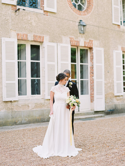 Bride and Groom kiss outside their french garden venue