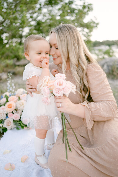 Mommy and me snuggling with flowers by Miami Family Photographer