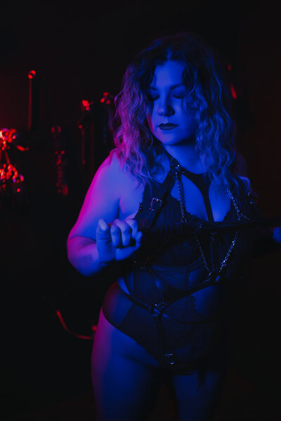 woman in neon room that is blue