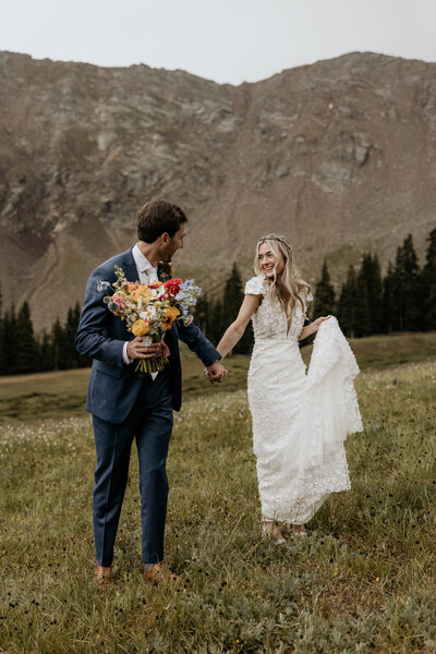 Wedding and Elopement Photography, Bride and groom share first kiss at Colorado mountain elopement.