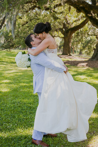 bride and groom kissing at boone hall plantation wedding