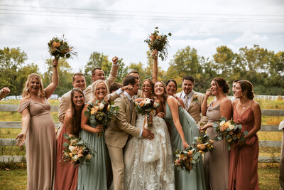 Cleveland wedding photographer cheering wedding party 