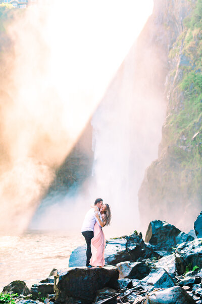 couple with snoqualmie falls in background engagement photos