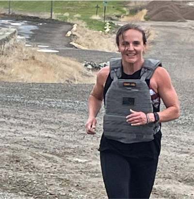 Trainer doing deadlifts