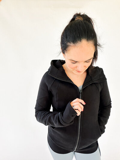 woman wearing black full zip lululemon scuba hoodie