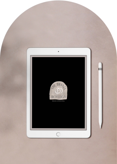 White iPad on tan background with brand logo