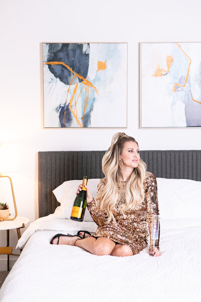 champagne in bed at a hotel in kansas city lifestyle photographer