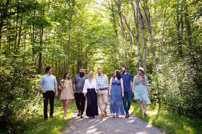 a family walking in the woods for their Ottawa family photography