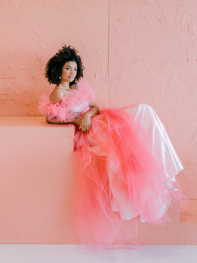 model posing in hot pink tulle dress