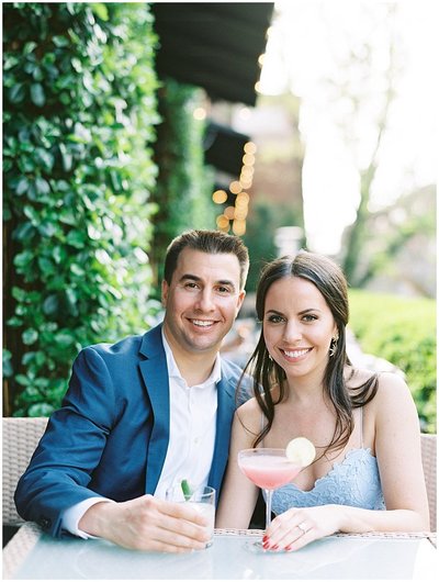 Bride and Groom Both in Blue Enjoy Cocktails at their Washington DC Engagement Session © Bonnie Sen Photography