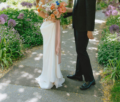 bride and groom lower half in garden