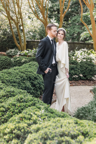 wedding couple sitting on the stairs at Swan House