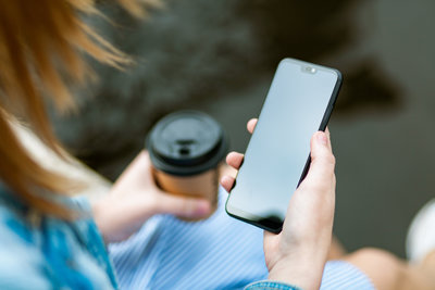 Canva - Woman Holding Black Smartphone With Black Screen