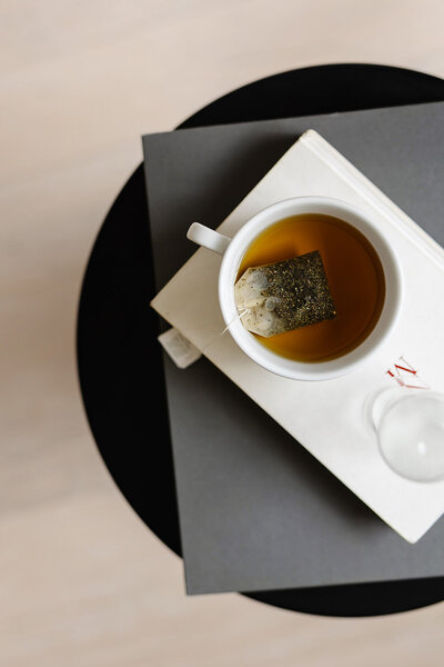 Mug of tea sitting on top of a table