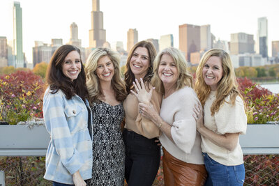 group of women celebrating the engagement of a friend, sister and daughter