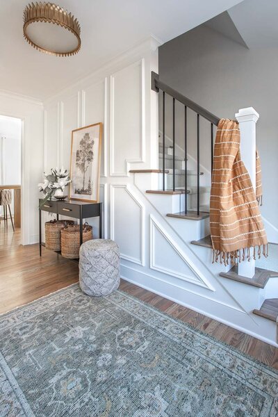 Stylish transitional entryway foyer designed by Haven + Harbor