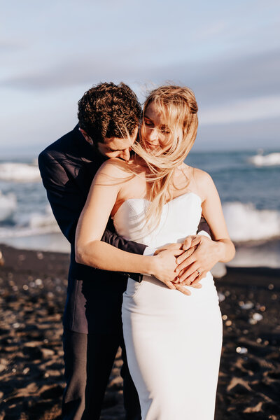 Iceland elopement photographer captures couple hugging after golden hour elopement