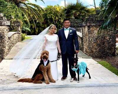 couple with wedding dog