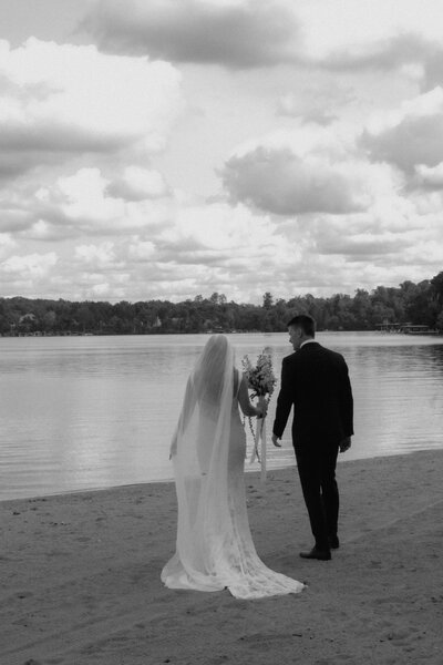 Engaged Couple celebrating with champagne showing off the new engagement ring
