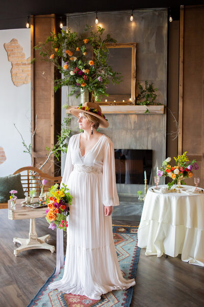 Seattle Wedding Photographers capture boho bridals with bride wearing hat and holding colorful bouquet