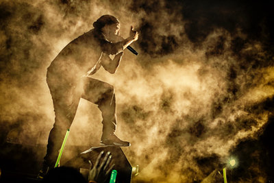 Trinidadian Soca star, Machel Montano, performs in a wave of stage fog. Photo by Ross Photography, Trinidad, W.I..