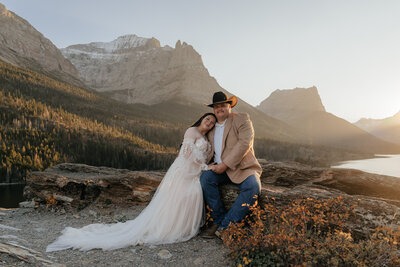 Couple embraces at Sun Point in Glacier National Park.