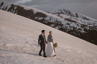 Couple hiking in Breckenridge on their wedding day