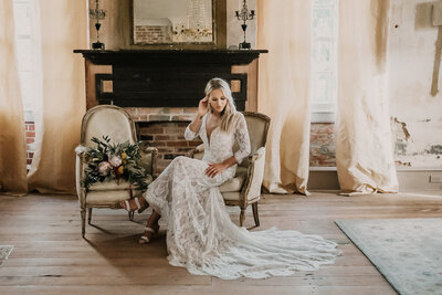 A Bridal portrait of a bride sitting on a chair at the John Knickerson house in Lafayette, LA