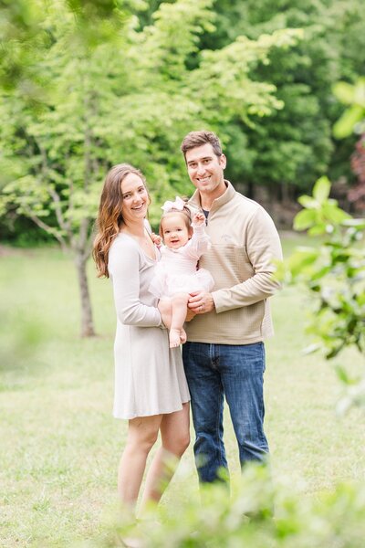 family of 3 posing for a photo in Barfield Crescent Park