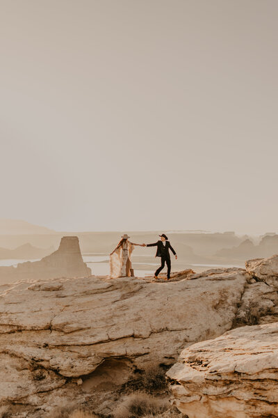 couple walks on cliff